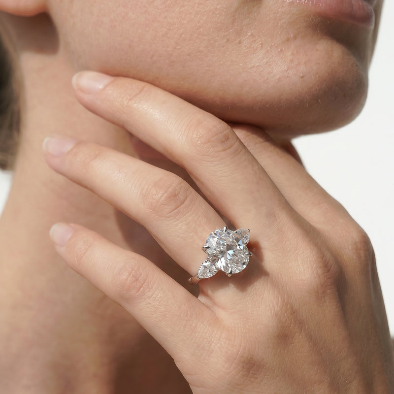 Elegance Pear Side Stone Engagement Ring (E+ VVS+)