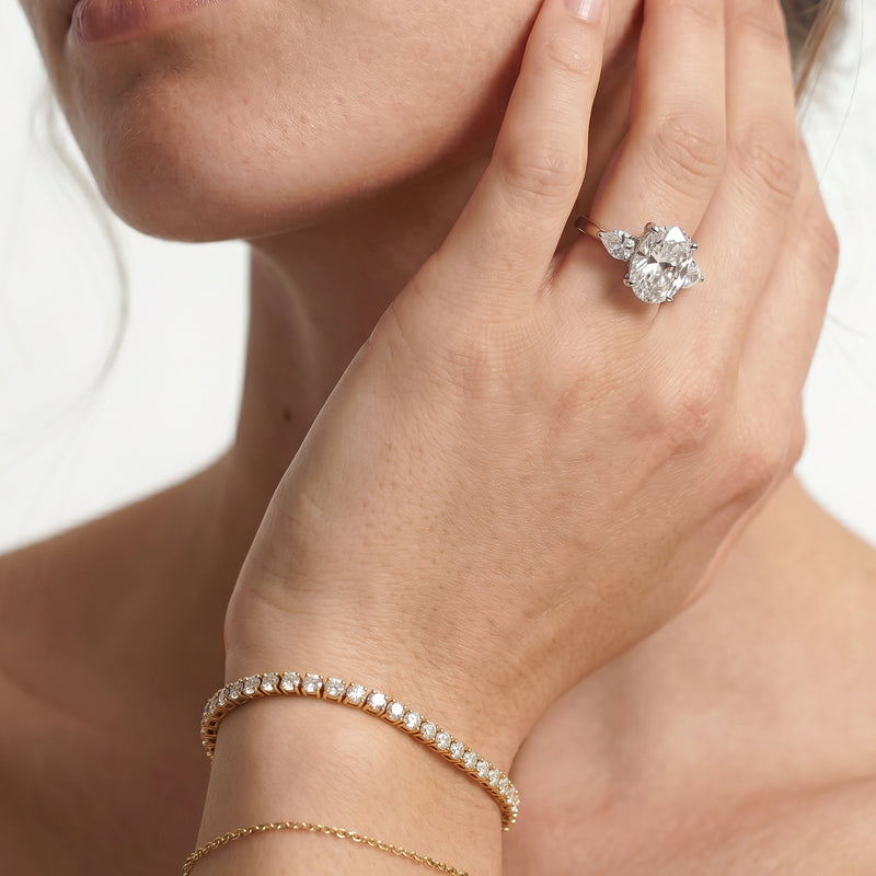 Elegance Pear Side Stone Engagement Ring (E+ VVS+)