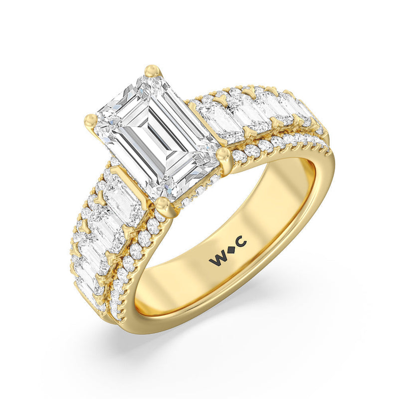 Emerald Side Stone Broad Band Hidden Halo Engagement Ring