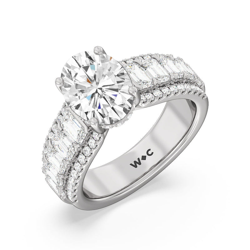 Emerald Side Stone Broad Band Hidden Halo Engagement Ring