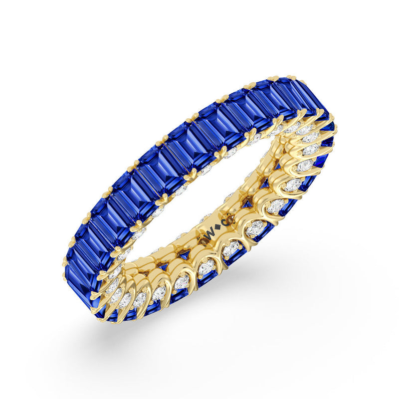 Created Sapphire Emerald Split Prong Basket Eternity Ring